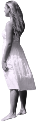 Jess standing, facing the wind as it blows her hair and dress back